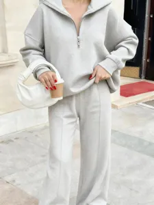 Casual grey half-zip sweatshirt and wide-leg trousers set, comfortable oversized daily wear.