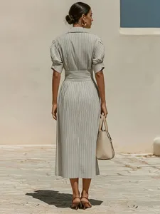 Detailed back view of women elegant striped shirt dress, bubble short sleeves and midi length.