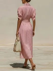 Chic striped midi shirt dress with front buttons, puff sleeves and elegant waist design.