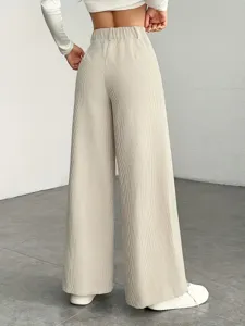 Detail view of casual high waist pleated wide leg pants in ribbed fabric, back silhouette.
