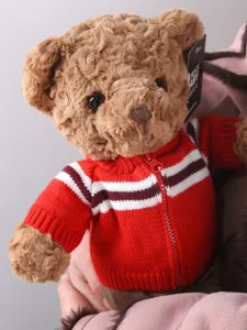 Plush teddy bear toy wearing a red zippered cardigan sweater, soft cute doll gift for kids.