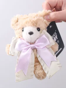Fluffy beige teddy bear plush pendant with large pink bow cute keychain bag charm accessory