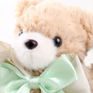 Cute plush teddy bear pendant keychain featuring a soft green bow ribbon accessory