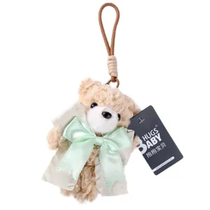 Fluffy plush teddy bear keychain with big bow and coat pendant for cute bag decoration item.
