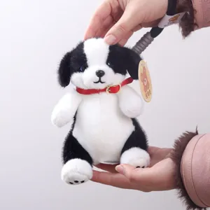 Cute black and white plush puppy doll bag pendant, soft stuffed animal toy for kids gifts.