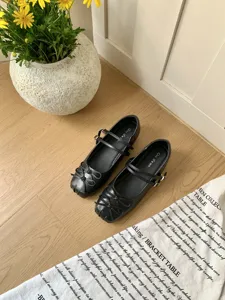 Black Mary Jane shoes featuring double straps, cute bow detail and inner heightening design.
