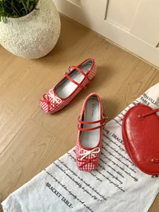 French red and white checkered Mary Jane shoes with double straps and cute bow design.