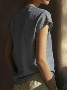 Back detail of the elegant women short sleeve casual blouse top in grey blue breathable fabric.