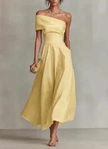 Detailed view of elegant off-the-shoulder solid color maxi dress for women, chic styling.
