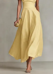 Detailed view of an elegant yellow maxi dress showcasing fitted waist and flowing skirt.