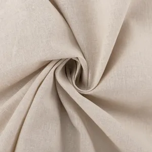 Premium beige cotton linen fabric detail close-up, showing natural texture and soft drape.