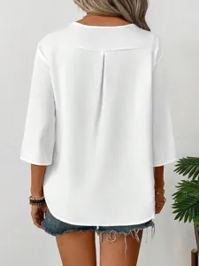 Close-up detail of the back pleat and 3/4 sleeve design on this casual white loose shirt.