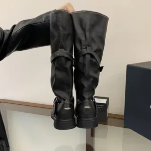 Black long motorcycle boots for women, vintage distressed tall boots with chunky heels.