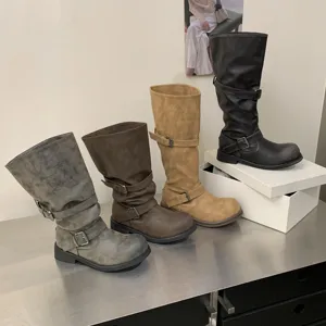 Vintage distressed knee-high motorcycle boots with double buckle straps in multiple colors.