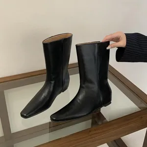 Black square toe mid-calf boots for women, elegant slip-on minimalist design detail view.
