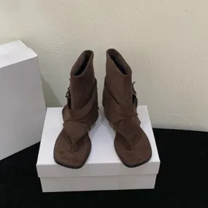 Chic retro minimalist designer women sandals with buckle strap and unique toe post style.