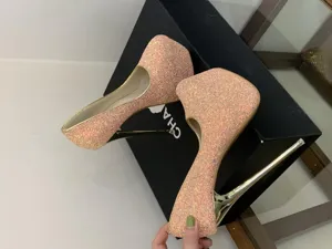 Glitter platform high heels with thin stiletto heel and sparkling sequin finish for women.