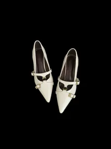 Beige pointed toe kitten heels detail shot, stylish faux leather dress shoes for women.