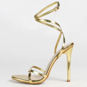 Metallic gold strappy high heels with stiletto heels and wrap-around ankle tie design.