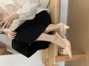 Polka dot slingback kitten heels with elegant bow detail for women, chic pointed toe shoes.