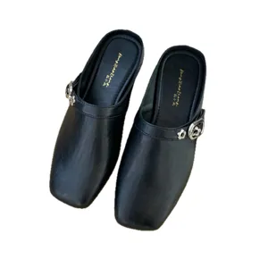 Black retro square toe low heel mules shoes for women, stylish minimalist slip-on footwear.