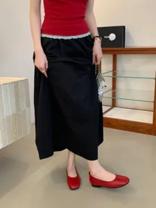 Red vintage flat Mary Jane shoes detail shot, soft sole casual footwear for women daily wear.