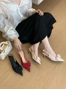 Chic polka dot slingback kitten heels with bow detail, elegant pointy toe pumps for women.