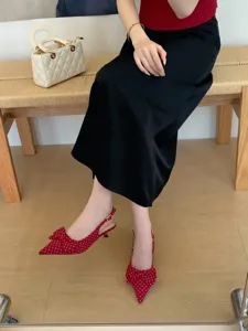 Red polka dot pointed-toe slingback kitten heels with bow, elegant women's shoes for chic look.