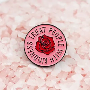 Pink rose enamel pin with kindness slogan, cute round brooch accessory for fashion clothing.