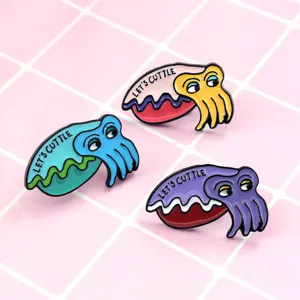 Close-up detail of cute cartoon squid enamel pins featuring vibrant colors and fun quotes.