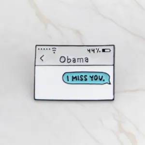 Close-up detail view of text message chat style enamel brooch pin for denim jackets.
