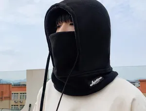 Detailed shot of a black fleece balaclava hood, showing warm winter fabric and facial coverage.