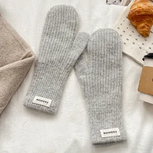 Cozy winter warm knitted solid color mittens with soft fleece material for cold outdoor daily wear.