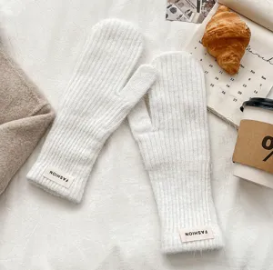 Winter solid color knitted mittens for women, warm plush fleece thermal gloves for cold weather.