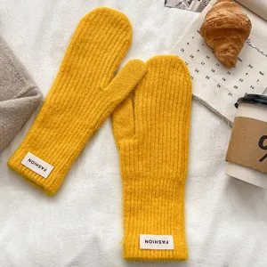 Winter warm knitted solid color mittens for women, soft cozy wool gloves for cold weather.