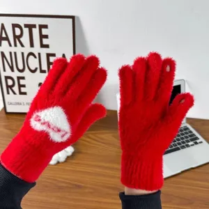 Red plush winter gloves for women, thick cozy knit mittens with heart pattern and warm fleece lining.
