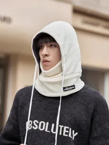 Fleece cycling face mask and warm hooded hat closeup detail showing soft fabric texture.
