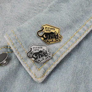 Cat coffin enamel pin detail showing metallic texture and funny quote design for clothing.