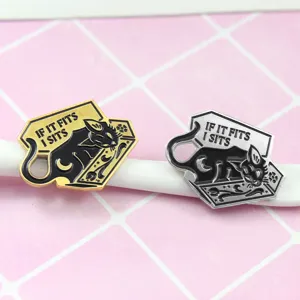 Close-up detail of the cute cat enamel brooch featuring a coffin design and funny quote.