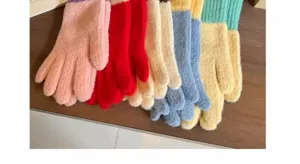 Close up of colorful knitted winter gloves detail, soft wool texture for warm daily wear.