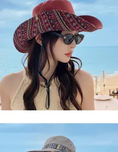 Detailed closeup shot of bohemian style ethnic western cowboy sun hat worn at beach seaside.
