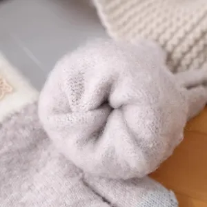 Close-up of winter thick fleece-lined knitted gloves inner texture cozy warm fabric detail