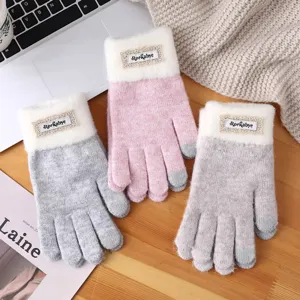 Cozy winter touchscreen knit gloves featuring a cute white cuff and warm fleece lining for cold days.