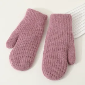Knit fuzzy winter mittens detail view, warm plush mittens close up for cold weather.