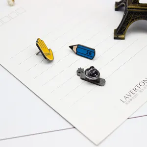 Cartoon enamel pin set featuring STOP hand and 2B pencil designs, ideal for denim bags.