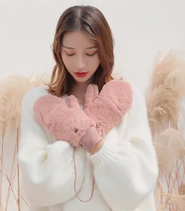 Cozy winter fleece mittens for women with convenient lanyard, soft pink plush warm gloves.