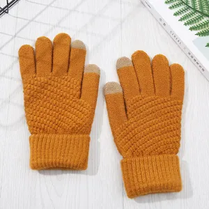 Detailed view of winter warm knitted touchscreen gloves featuring cozy textured grip design.