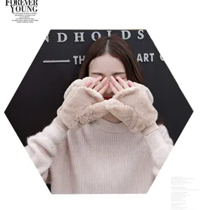 Plush winter gloves detail showcasing soft faux fur lining, cozy fingerless design and warmth.