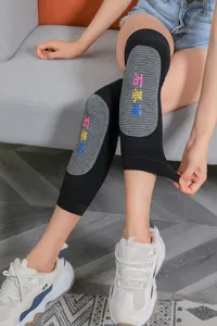 Detailed shot of graphene thermal knitted knee warmers showing soft fleece lining texture.