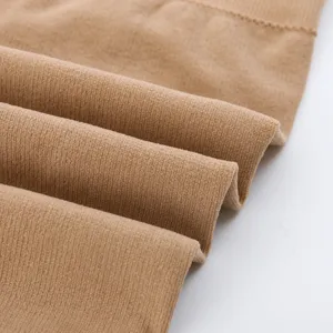 Close-up of thick thermal fleece knit fabric texture for winter warm gear detail view.
